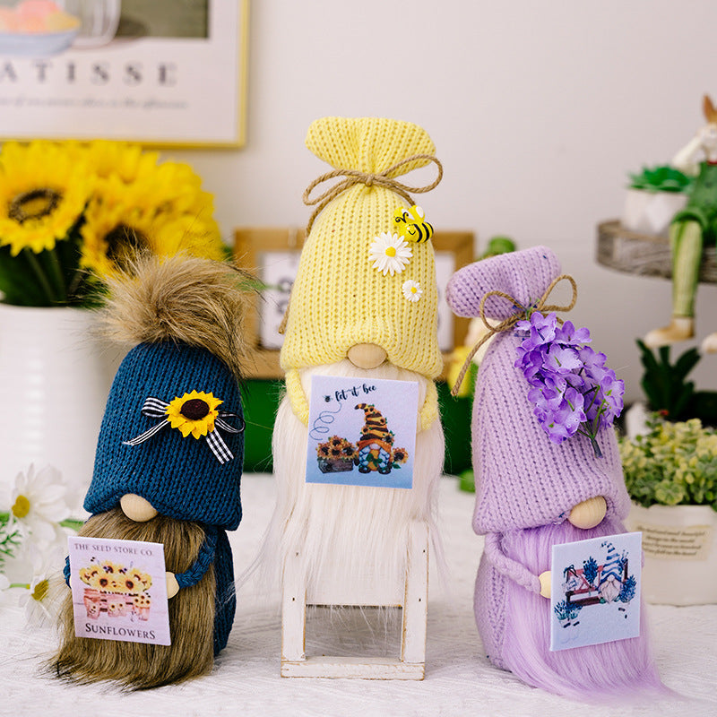 Knitted hat holding card flower gnomes