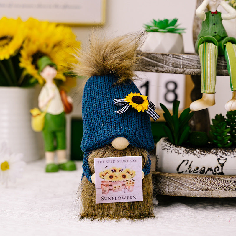 Knitted hat holding card flower gnomes